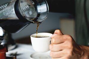 pouring black coffee